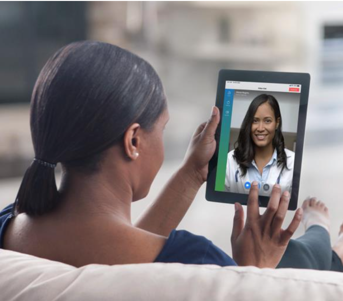 Patient talking to a doctor on a tablet